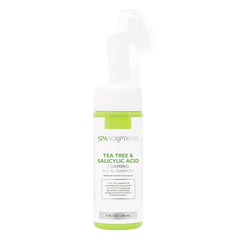 SpaScriptions Tea Tree & Salicylic Acid Foaming Cleanser bottle on a bathroom shelf for oil balance.