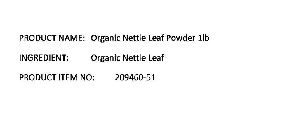 Nettle leaf powder in a measuring scoop for herbal tea use