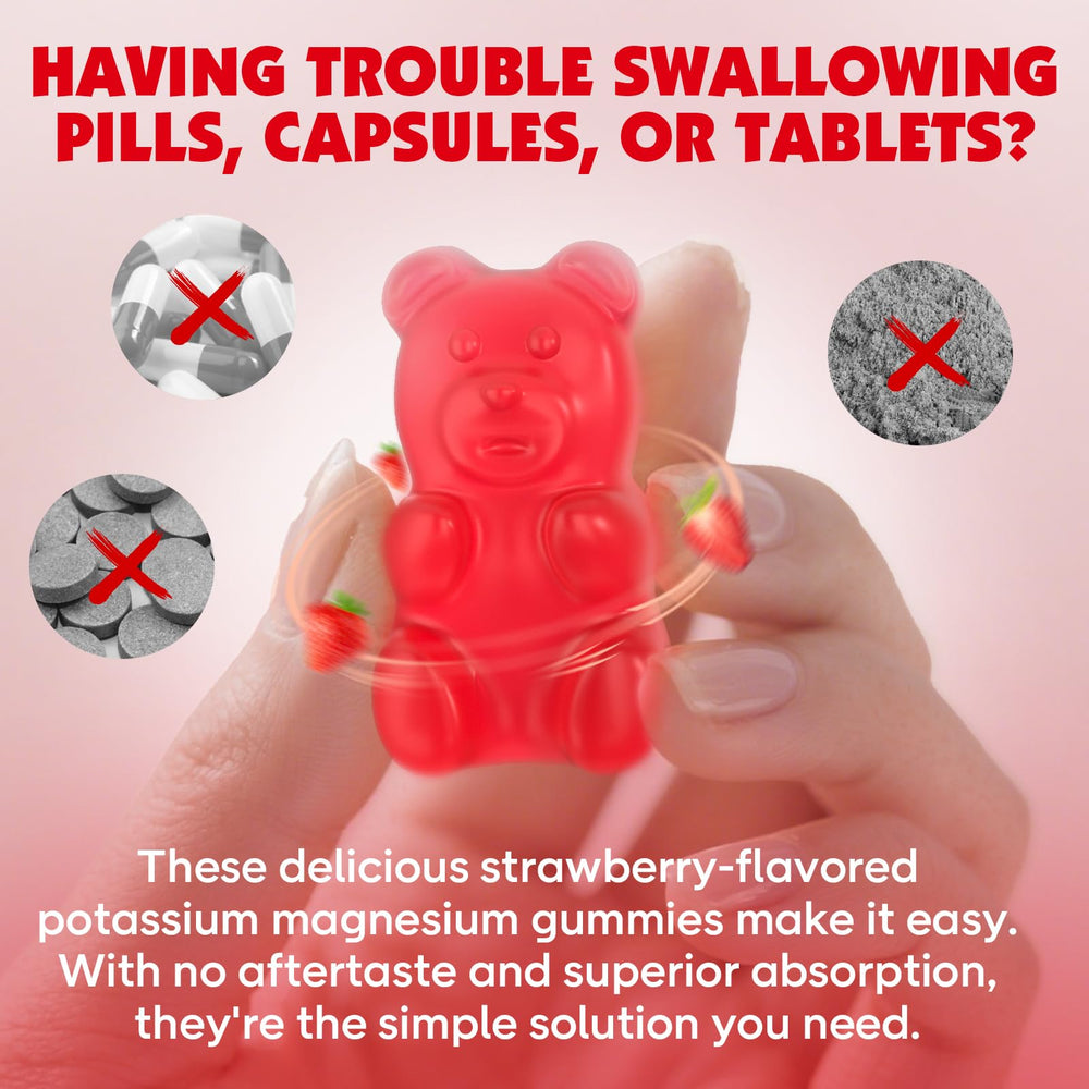 Two strawberry flavored gummies next to a strawberry