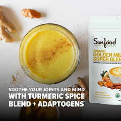 Close up of turmeric, ginger, cinnamon, and cardamom spices