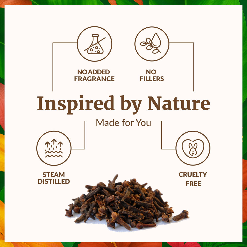 Clove buds with essential oil bottle