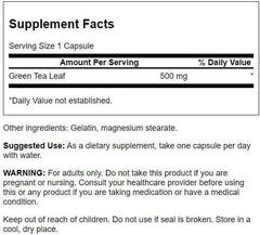 Close-up of Swanson Green Tea Extract supplement capsules with label