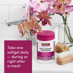 Lifestyle scene showing cranberry pills with glass of water