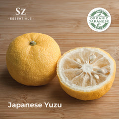 Yuzu fruit peels and essential oil bottle