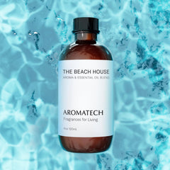 Close-up of The Beach House bottle label featuring Bergamot, Coconut Milk, and Sandalwood notes