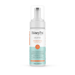 The Honey Pot Prebiotic Wash bottle pour showing gentle cleansing for sensitive skin