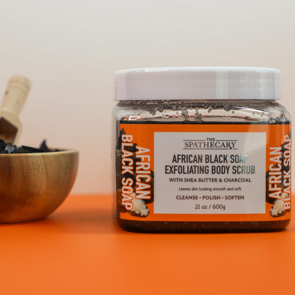 Scoop action with The Spathecary Grapefruit Orange Mimosa scrub on skin.