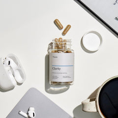 Thesis Clarity bottle placed on a desk in a lifestyle setting