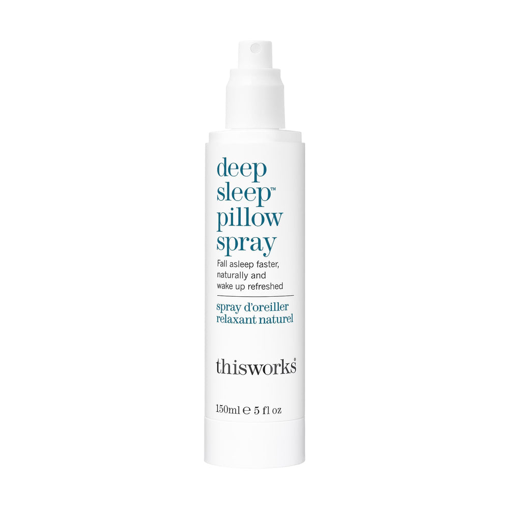 THISWORKS Deep Sleep Pillow Spray bottle on bed linens for a calming night ritual.