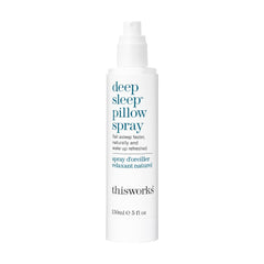 THISWORKS Deep Sleep Pillow Spray bottle on bed linens for a calming night ritual.