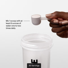 Athlete preparing THORNE Amino Complex during pre-workout for recovery support.