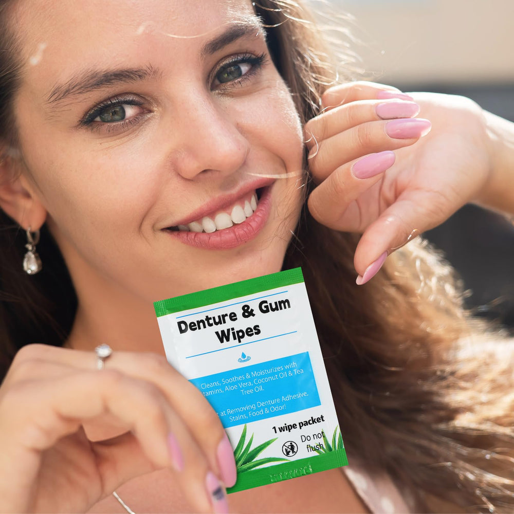 White denture cleaning wipe removing denture adhesive