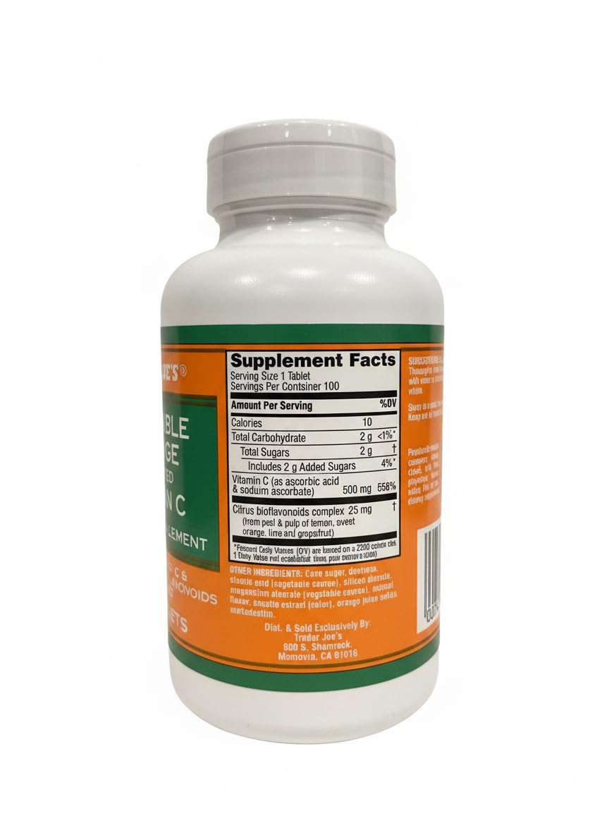 Close-up of orange flavored Vitamin C chewable tablets in bottle
