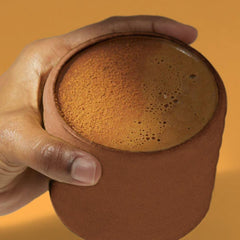 Morning energy concept with a cup and powder scoop of TruBrain Morning Mushrooms