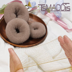 TsMADDTs elastic ties stabilize buns without pulling or damaging hair.
