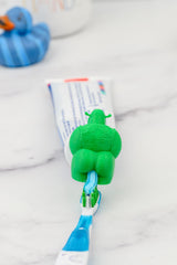 Shrek toothpaste topper on Crest and Colgate tubes for compatibility