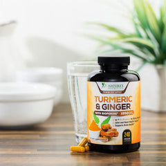 Turmeric Curcumin capsules shown with a glass of water