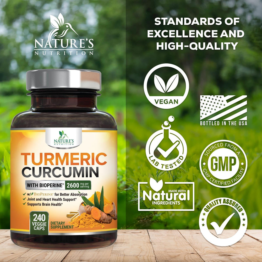 Organic turmeric root beside capsules