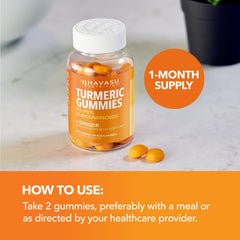 60-count turmeric and ginger gummies bottle beside a glass of water