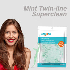 Close-up of mint-flavored dual-action floss sticks