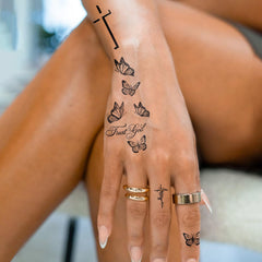UBICA Tattoo Tech butterfly-cross closeup showing crisp black lines