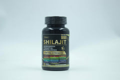 Capsules spilling beside herbal ingredients