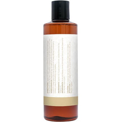 Close-up of vanilla essential oil bottle with jojoba and sweet almond oils