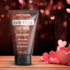 Viking Revolution Hair Paste hands applying the product for medium-hold styling.