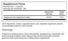 Close-up of Vitacost Magnesium bottle labeling showing 500 mg per capsule