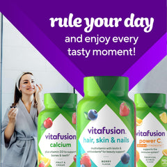 Vitafusion bottle with raspberry gummies on white background