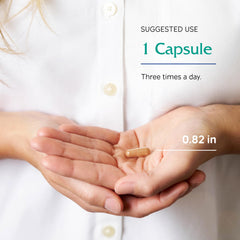 Capsules next to a cup of brewed green tea