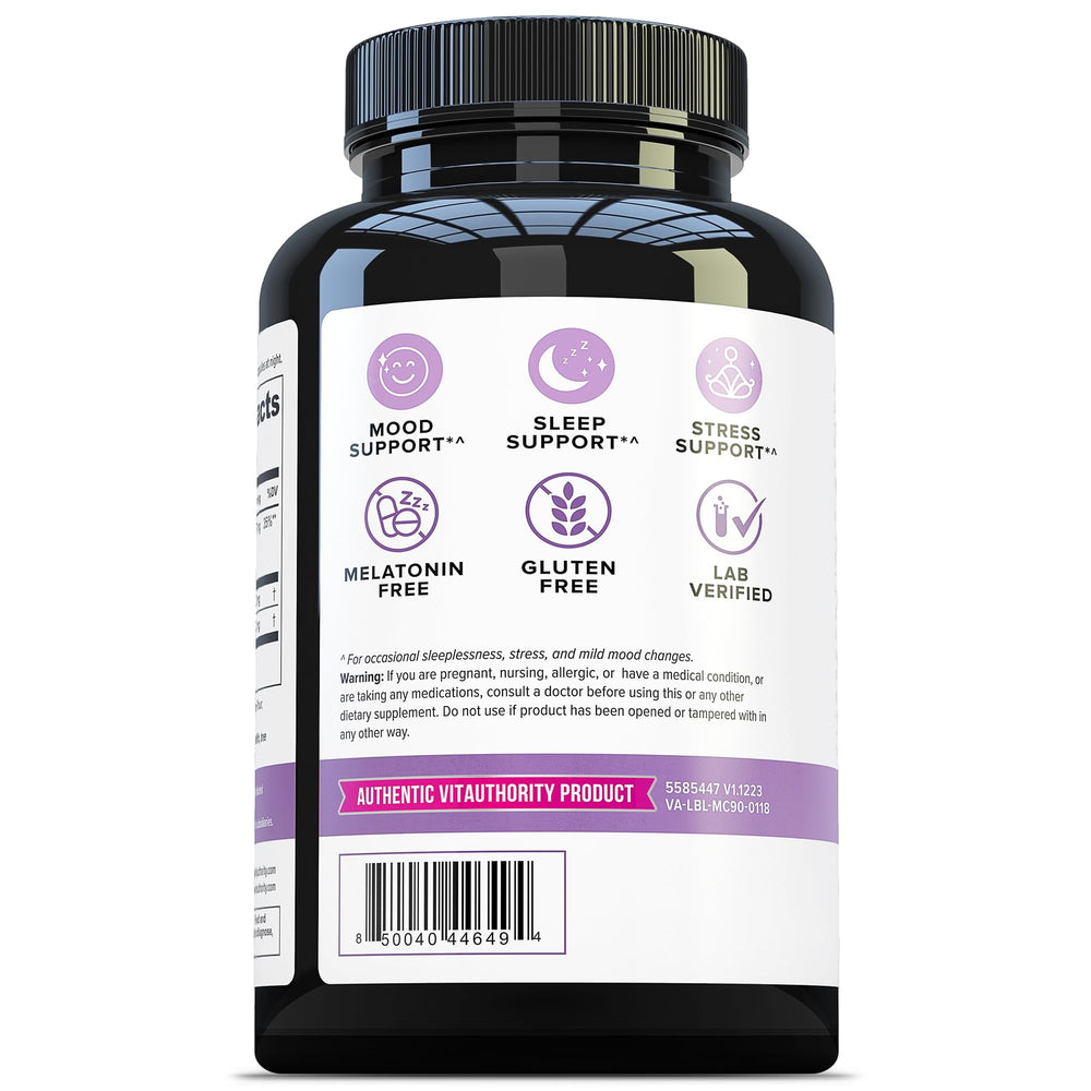 Opened bottle with capsules on a wooden surface