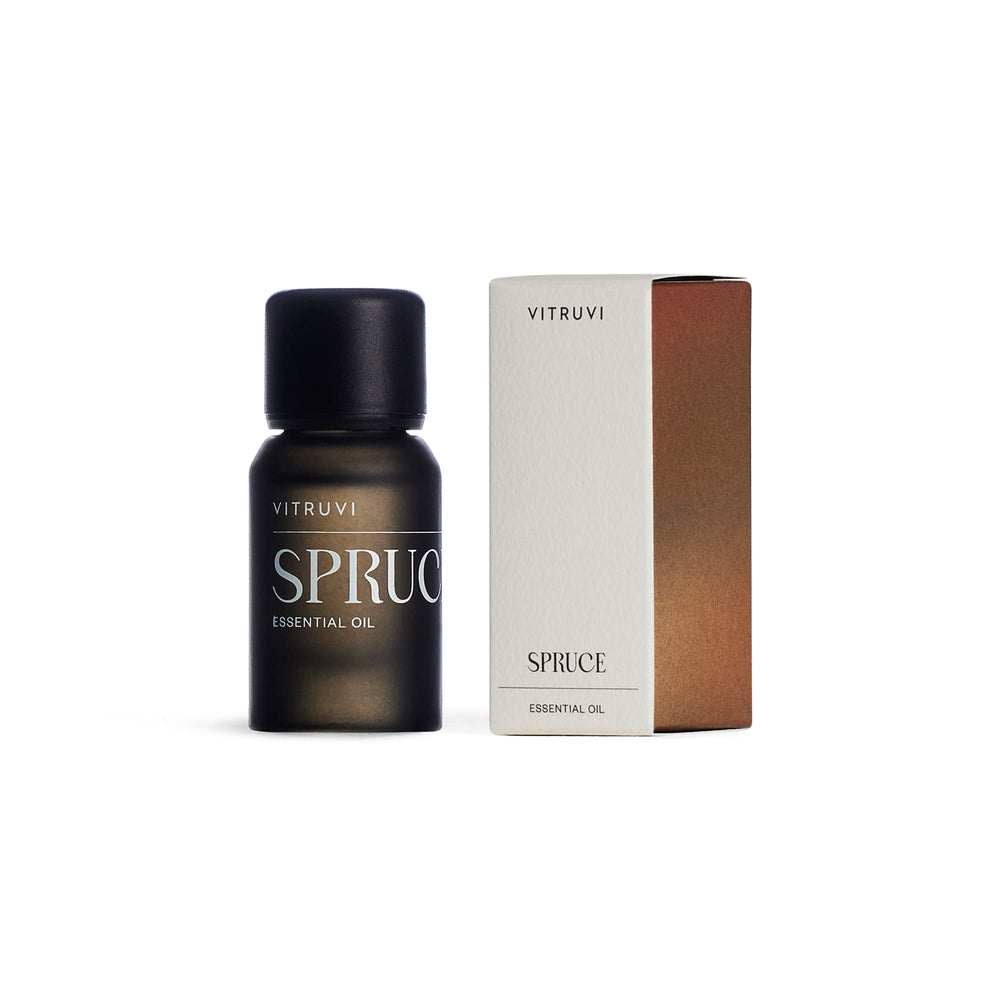 Spruce essential oil shown with diffuser