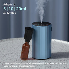 Close-up of detachable nozzle compatible with 5-20ml oil bottles