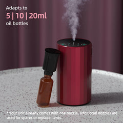 Red waterless diffuser on a desk or table