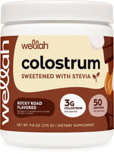 Wellah Colostrum Rocky Road flavored supplement bottle with scoop