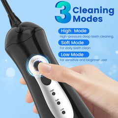 Portable WellLeo water dental flosser shown with USB charging