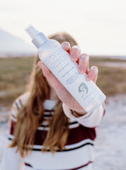 Close-up of White Egret Magnesium Oil Spray bottle