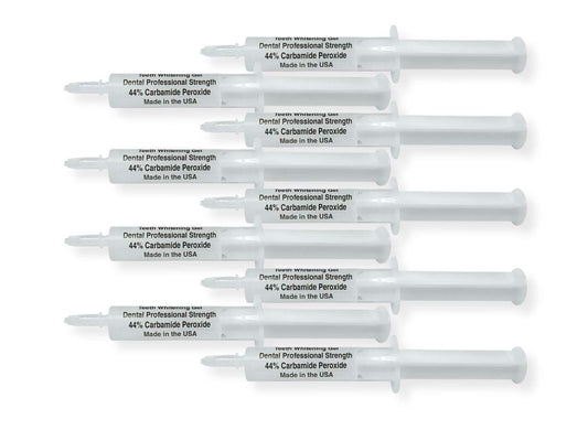 White Teeth Global 44% carbamide peroxide teeth whitening gel kit with 10 syringes, 2 trays, and a shade guide.