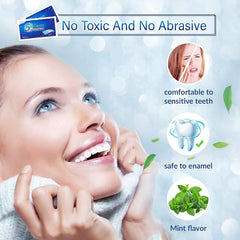 Hands applying whitening strips on teeth
