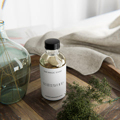 The Magic Scent Whitewood Diffuser Oil bottle atop a diffuser setup.