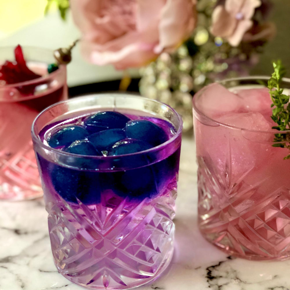 Bottle beside citrus to demonstrate color change effect