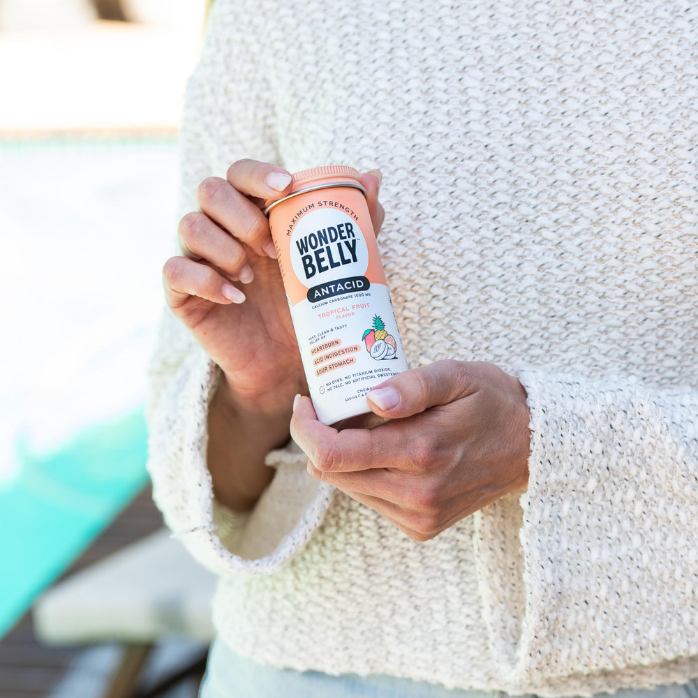 Wonderbelly bottle recycling symbol emphasizes eco-friendly packaging.