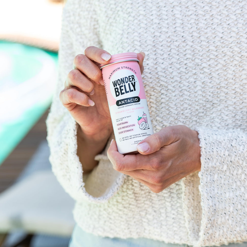 Wonderbelly antacid flavor swirl suggesting strawberry-milkshake taste for easy relief.