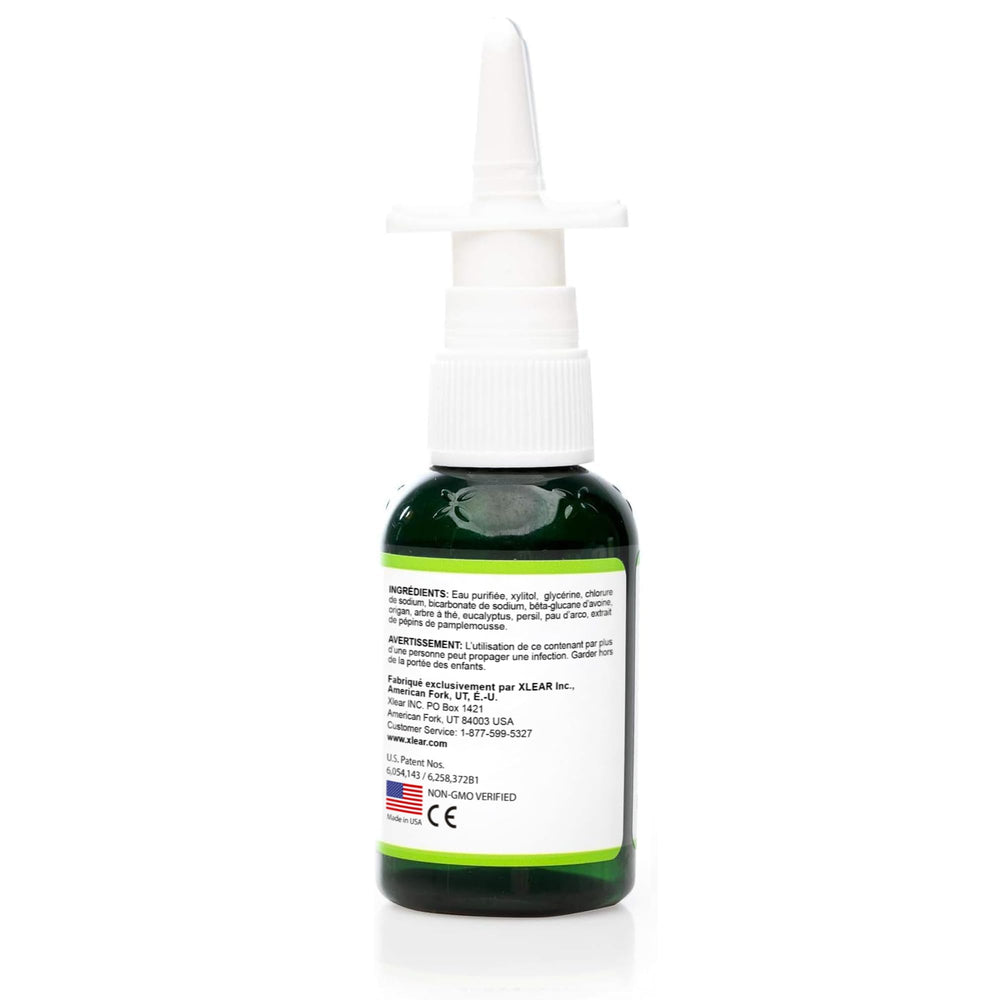 Xlear Rescue bottle releasing a gentle mist for everyday relief.