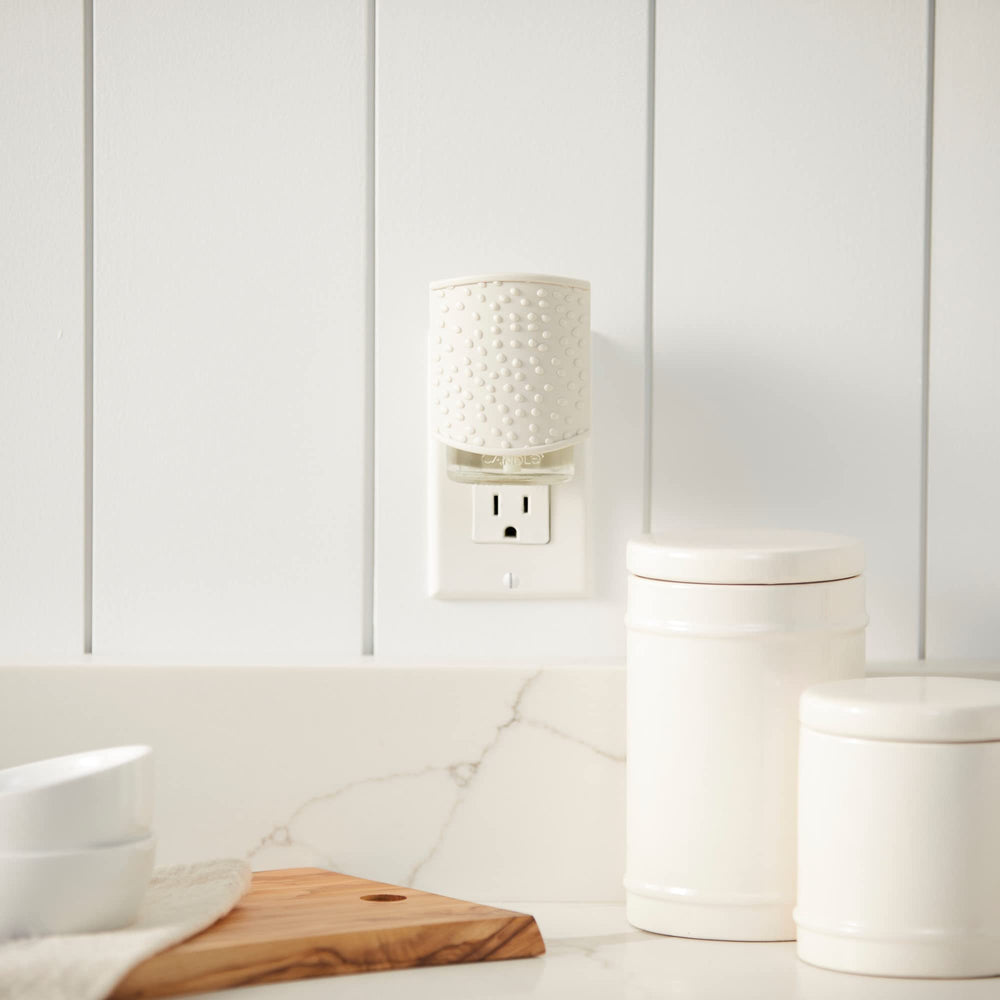 ScentPlug Diffuser with light sensor technology in a room