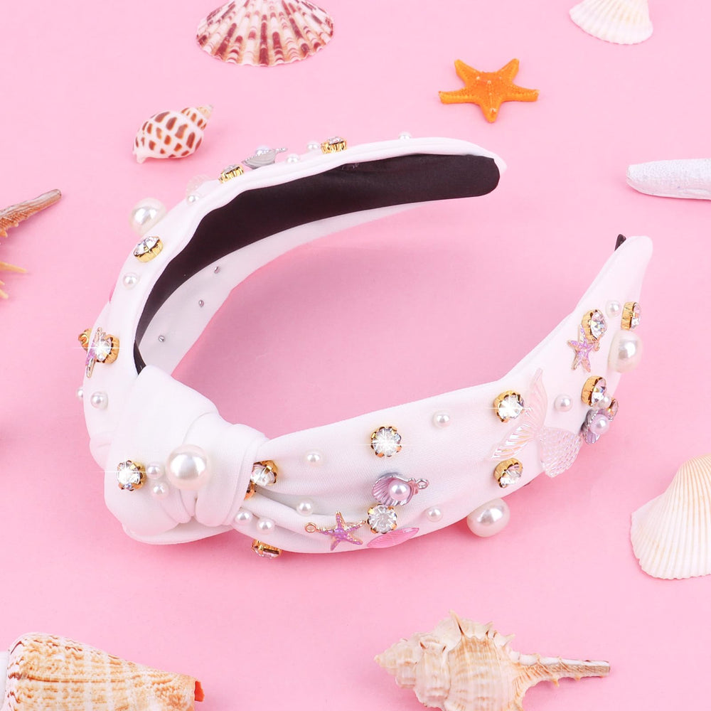 Crystal mermaid tail design on the headband catching light at parties.