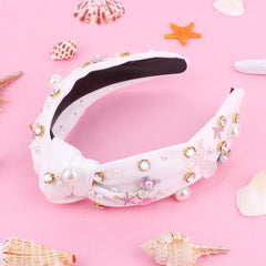 Crystal mermaid tail design on the headband catching light at parties.