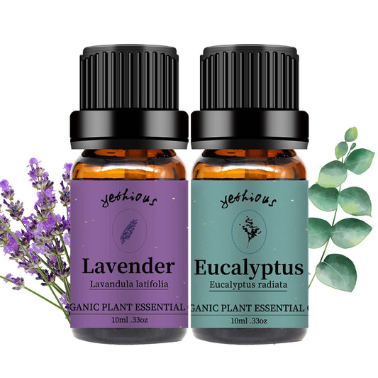 Bottle of lavender essential oil with purple lavender flowers