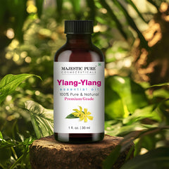 Ylang Ylang essential oil in amber glass bottle with dropper